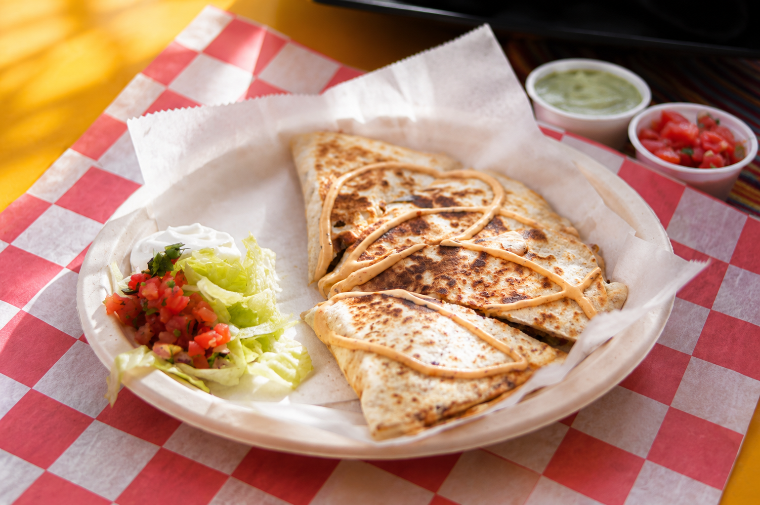Cut quesadilla with salsa